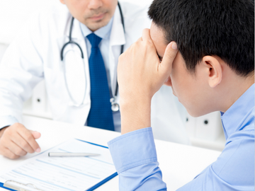 Man talking to doctor about erectile dysfunction
